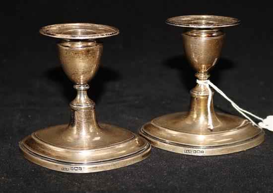 A pair of George V silver dwarf candlesticks by Thomas A. Scott, Sheffield, 1911, 3.5in.